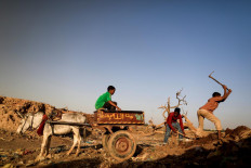 Mazeen, (R), 12, collects clay in an area known as the 'Potters Village' in Alqamayir, Omdurman, Sudan, February 16, 2020. Reuters/Zohra Bensemra