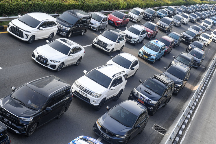 Cars crawl in bumper-to-bumper traffic on June 19, 2024, along Jl. Gatot Subroto in South Jakarta.