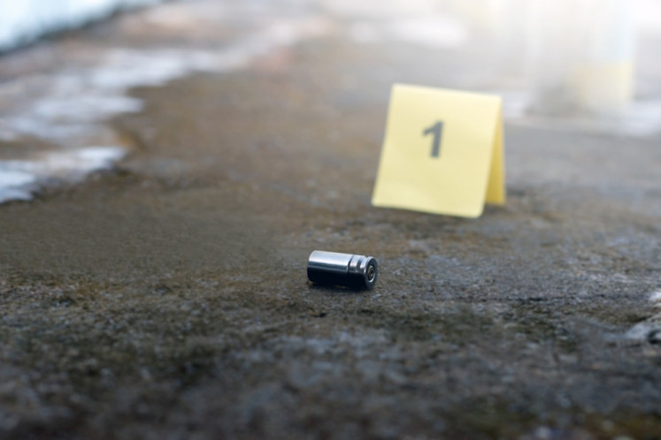 An illustration of a bullet casing in a crime scene.