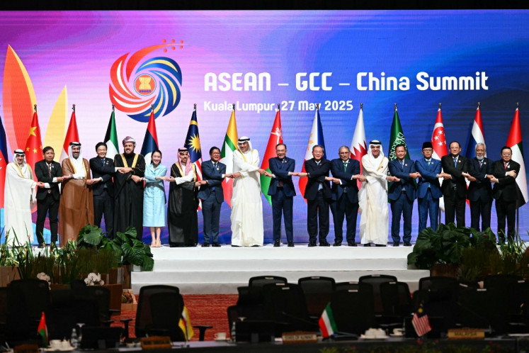 (Left-right) Secretary General of the Gulf Cooperation Council (GCC) Jasem Albudaiwi, Myanmar's Permanent Secretary of the Ministry of Foreign Affairs Aung Kyaw Moe, Qatar's Minister of Commerce and Industry Faisal bin Thani bin Faisal Al Thani, Singapore's Prime Minister Lawrence Wong, Oman's Deputy Prime Minister for Relations and International Affairs Sayyid Asaad Tariq Taimur Al Said, Thailand's Prime Minister Paetongtarn Shinawatra, Saudi Arabia's Foreign Minister Prince Faisal bin Farhan al-Saud, Philippines' President Ferdinand Marcos Jr, Crown Prince of Kuwait Sheikh Sabah Khaled al-Hamad al-Sabah, Malaysia's Prime Minister Anwar Ibrahim, China's Premier Li Qiang, Brunei Minister of Foreign Affairs Erywan Yusof, Ruler of the UAE's Emirate of Ras al-Khaimah Sheikh Saud bin Saqr al Qasimi, Cambodia's Prime Minister Hun Manet, Indonesia's Minister for Foreign Affairs Sugiono, Laos' Prime Minister Sonexay Siphandone, East Timor's Prime Minister Xanana Gusmao and ASEAN Secretary-General Kao Kim Hourn pose for a group photo at the ASEAN - Gulf Cooperation Council (GCC) - China Summit after the 46th Association of Southeast Asian Nations (ASEAN) Summit in Kuala Lumpur on May 27. 