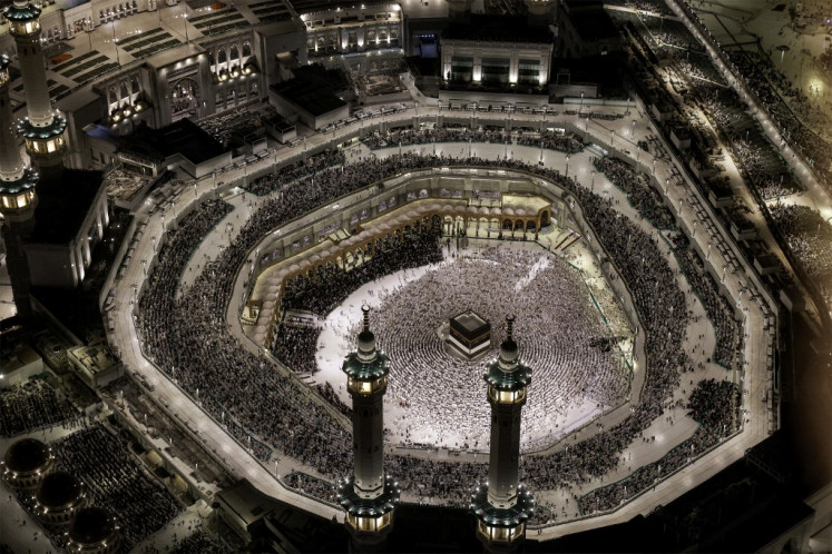 Muslims gather around the Kaaba, Islam's holiest shrine located in the Great Mosque of Mecca, to pray on June 1, 2025, during the annual haj to the holy city in Saudi Arabia.